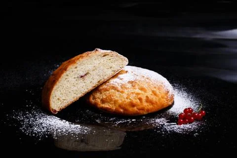 Sweet cupcake in round bread shape with filling. Photo in section. Stock Photos
