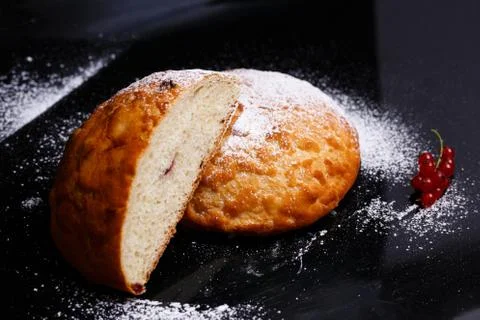 Sweet cupcake in round bread shape with filling. Photo in section. Stock Photos