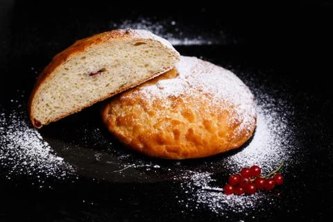 Sweet cupcake in round bread shape with filling. Photo in section. Stock Photos