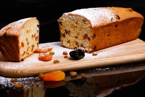 Sweet cupcake in the shape of bread. Cupcake with raisins, dried apricots, plums Stock Photos