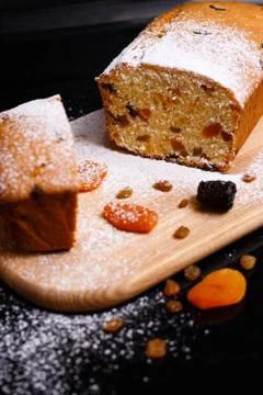Sweet cupcake in the shape of bread. Cupcake with raisins, dried apricots, plums Stock Photos