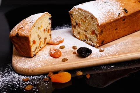 Sweet cupcake in the shape of bread. Cupcake with raisins, dried apricots, plums Stock Photos