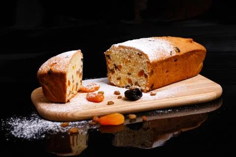 Sweet cupcake in the shape of bread. Cupcake with raisins, dried apricots, plums Stock Photos