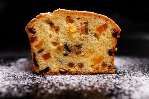 Sweet cupcake in the shape of bread. Cupcake with raisins, dried apricots, plums Stock Photos