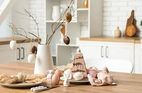 Sweet curd Easter cake, toy bunnies, pussy willow branches and eggs on kitche Stock Photos