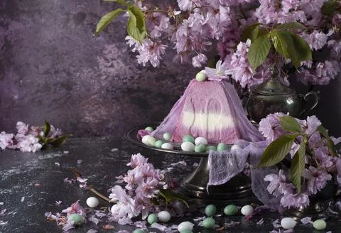 Sweet curd orthodox easter on the background of purple sakura, traditional food Stock Photos