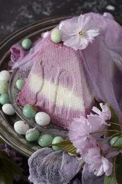 Sweet curd orthodox easter on the background of purple sakura, traditional food Stock Photos