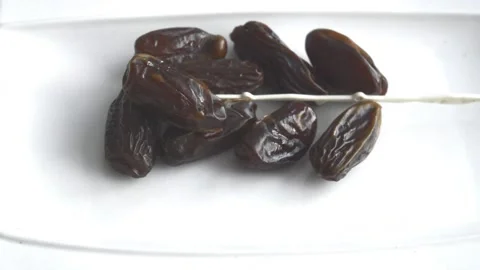 Sweet dates in a plate Stock Footage 130379106