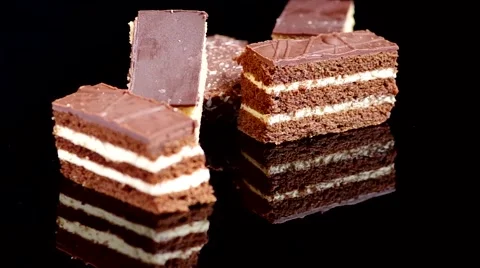 Sweet desserts on a black background with reflection Stock Footage 45543837