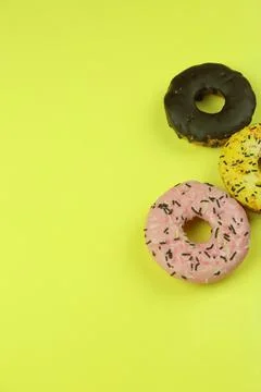Sweet donut with colored background Stock Photos