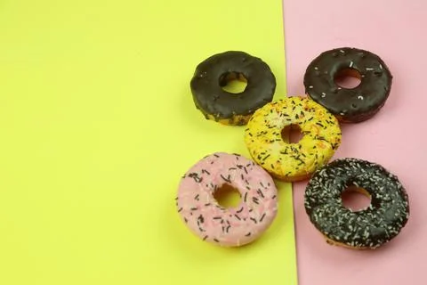 Sweet donut with colored background Stock Photos