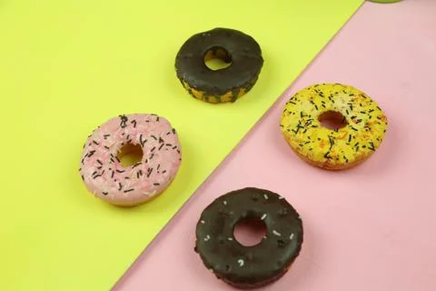 Sweet donut with colored background Stock Photos