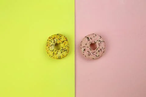 Sweet donut with colored background Stock Photos