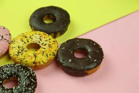 Sweet donut with colored background Stock Photos