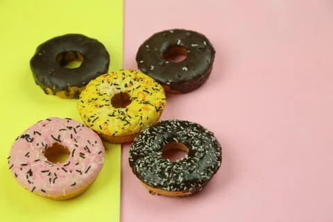 Sweet donut with colored background Stock Photos