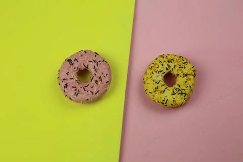 Sweet donut with colored background Stock Photos