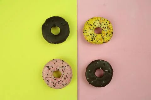Sweet donut with colored background Stock Photos