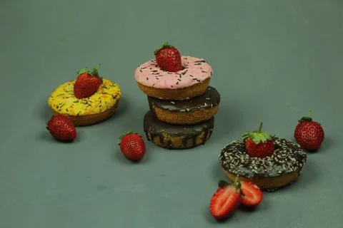 Sweet donut with colored background Stock Photos