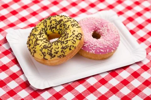 Sweet doughnuts on paper plate Stock Photos
