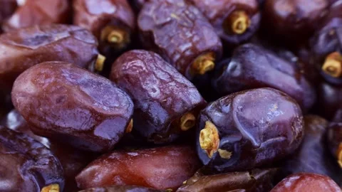 Sweet dried dates texture circle rotation close up Video stock 239661875