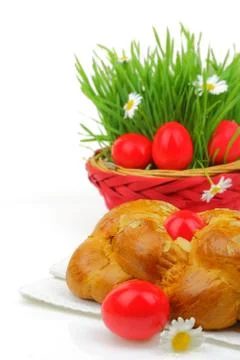 Sweet Easter bread with red eggs and green grass Stock Photos