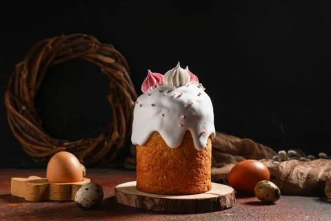 Sweet Easter cake with meringue and eggs on dark background Stock Photos