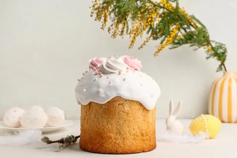 Sweet Easter cake with meringue, eggs, mimosa flowers and pussy willow branch Stock Photos