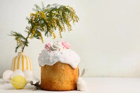 Sweet Easter cake with meringue, eggs, mimosa flowers and pussy willow branch Stock Photos