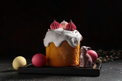 Sweet Easter cake with meringue, painted eggs, toy bunny and pussy willow bra Stock Photos
