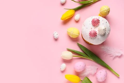 Sweet Easter cake with meringue, painted eggs and tulip flowers on pink backg Stock Photos