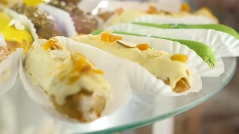 Sweet eclairs on transparent plate close up Stock Footage 80283826