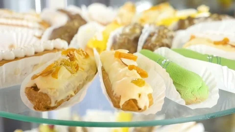 Sweet eclairs on transparent plate Stock Footage 80283846