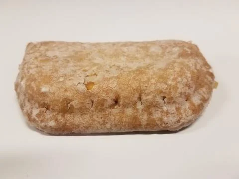 Sweet filled pie on white surface with sugar coating Stock Photos