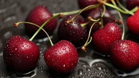 Sweet fresh cherries with dew drops - 4k Stock Footage 80055991