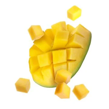Sweet fresh mango cut in cubes flying on white background Stock Photos