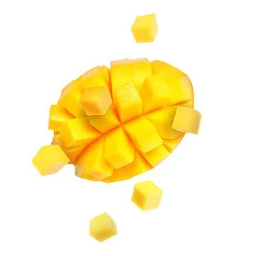 Sweet fresh mango cut in cubes flying on white background Stock Photos