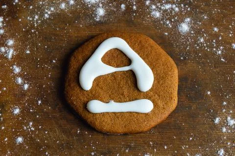 Sweet gingerbread with white icing in the shape of the letter A Stock Photos