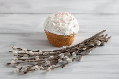Sweet homemade Easter cake with willow branches on a gray wooden background Stock Photos
