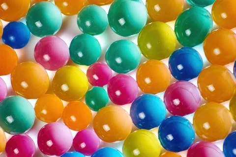 Sweet jelly balls background pattern. Dessert balls scattered on the table. Stock Photos
