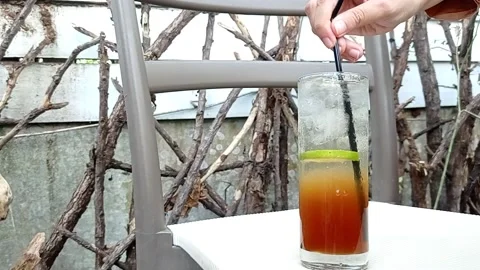 Sweet lemon tea on the white table Stock Footage 145463520