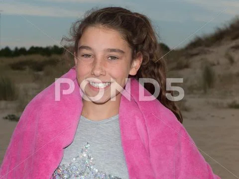 Sweet little girl outdoors with curly hair in the wind Stock Photos