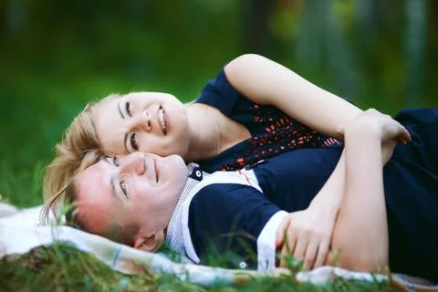 Sweet lovers lying on grass Stock Photos