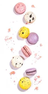 Sweet macaroons macarons crumbs isolated on white background. French cookie.. Stock Photos