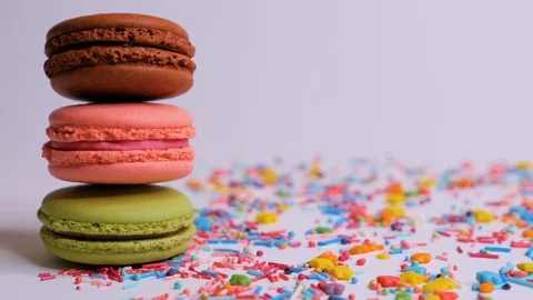 Sweet macaroons with multi colored confectionery dressing. Stock Footage 106985119