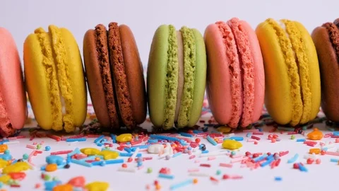 Sweet macaroons with multi colored confectionery dressing. Stock Footage 106985218