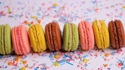 Sweet macaroons with multi colored confectionery dressing. Stock Footage 107187086