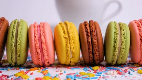 Sweet macaroons with multi colored confectionery dressing. Stock Footage 107413447