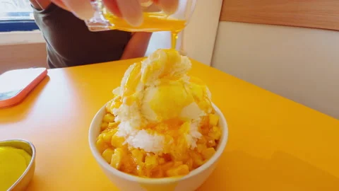 Sweet Mango Dessert With Shaved Ice And Cream Being Covered In Mango Sauce, Trop Stock Footage 337025560