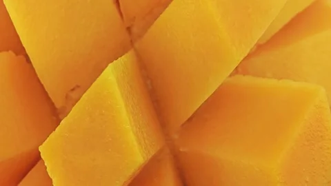 Sweet mango slice cube, top view. Stock Footage 310550656