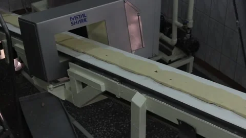 The sweet mix for making sweet bars moves on a conveyor belt. Stock Footage 128642947
